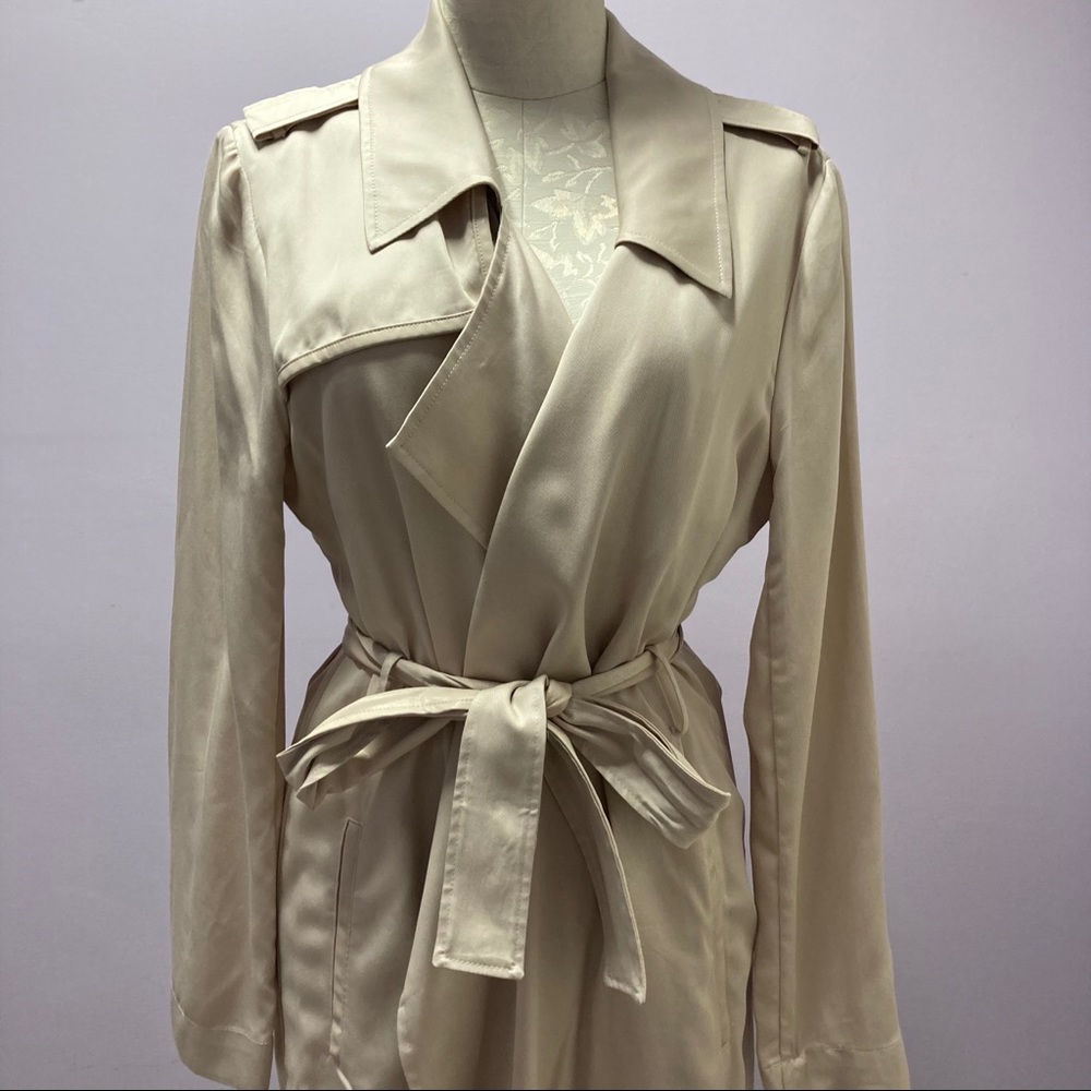 This NEW tan rap coat is from Badgley mischka